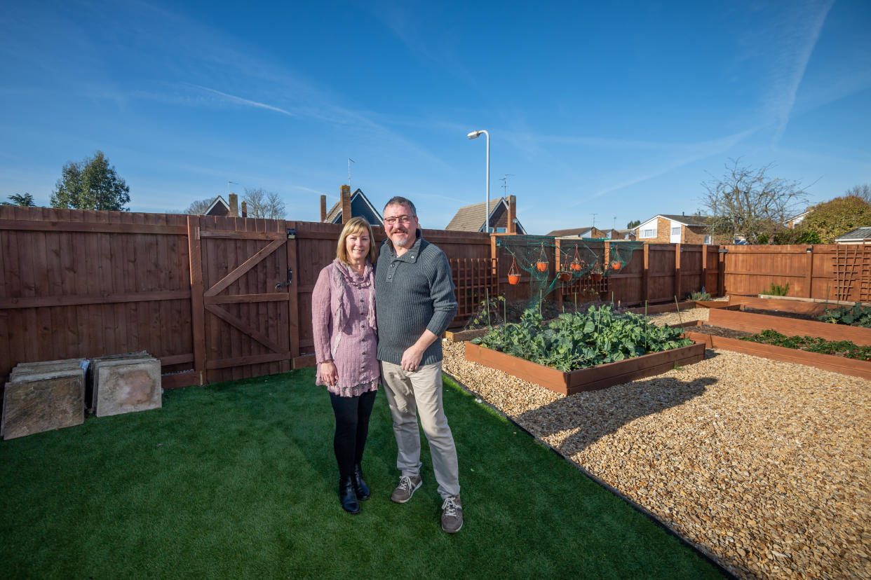 Lee and Kirstie Lawes in thier garden at their home in Lincolnshire. (SWNS)