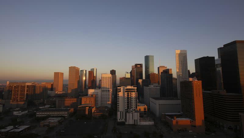 The Houston skyline is seen at sunrise on Thursday, March 10, 2022. Texas has seen an influx of residents moving there.