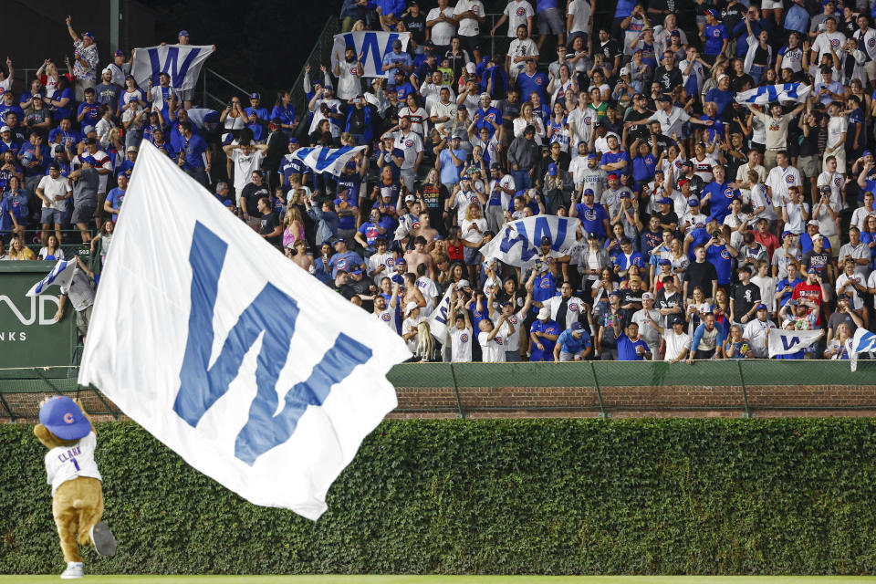 Aug 16, 2023; Chicago, Illinois, USA; Chicago Cubs fans celebrate Cubs 4-3 win against the Chicago White Sox at Wrigley Field. Mandatory Credit: Kamil Krzaczynski-USA TODAY Sports