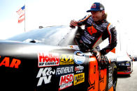 RICHMOND, VA - APRIL 27: Travis Pastrana, driver of the #99 Boost Mobile Toyota, gets out of his car on the grid during qualifying for the NASCAR Nationwide Series Virginia 529 College Savings 250 at Richmond International Raceway on April 27, 2012 in Richmond, Virginia. (Photo by Jeff Zelevansky/Getty Images for NASCAR)