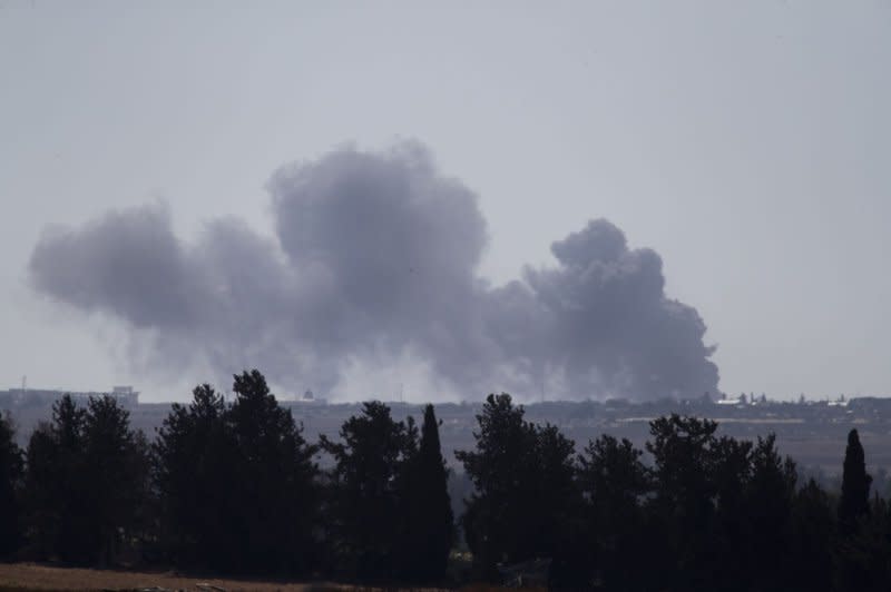 Israeli bombing inside Rafah in southern Gaza Strip is seen from inside southern Israel on Tuesday. Israel entered Rafah and took over the Keren Shalom crossing on May 6, in what appeared to be a "limited" ground offensive against Hamas. Photo by Jim Hollander/UPI