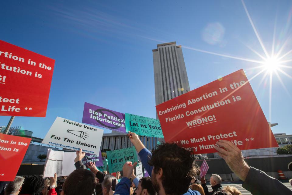 Abortion-rights and anti-abortion activists voice their opinions outside the Florida Supreme Court after the Court heard arguments on the proposed abortion amendment Wednesday, Feb. 7, 2024.