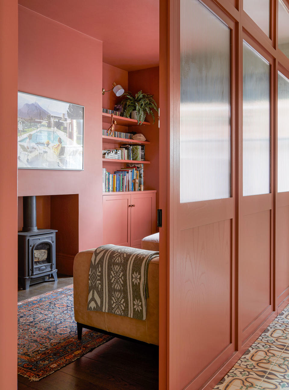 Red living room with red ceiling and room divider