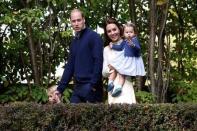 Britain's Prince William, Catherine, Duchess of Cambridge, Prince George and Princess Charlotte arrive at a children's party at Government House in Victoria, British Columbia, Canada, September 29, 2016. REUTERS/Chris Wattie