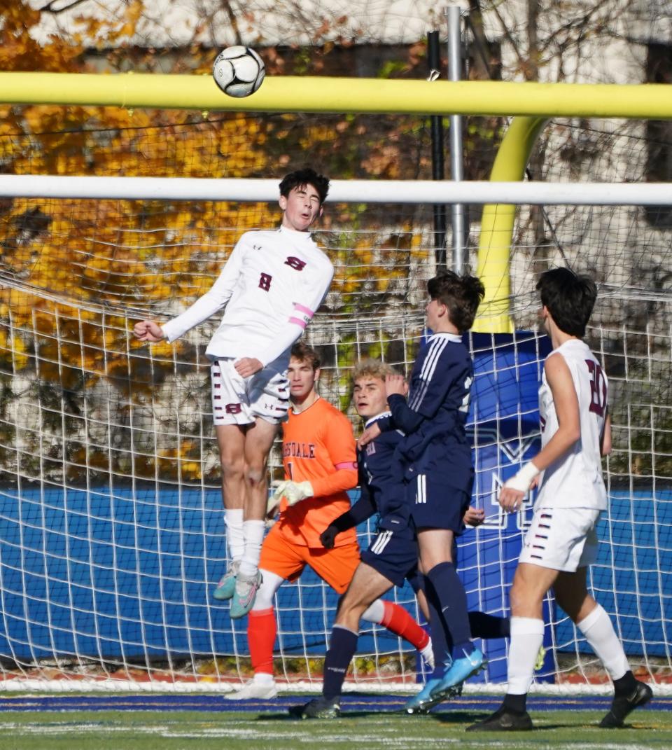 ScarsdaleÕs Henry McAllister (8) leaps for a header during their 4-1 win over Smithtown West in the NYSPHSAA boys soccer Class AA semifinal at Middletown High School in Middletown on Saturday, November 2023.