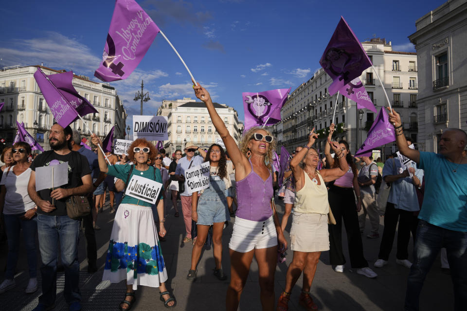 People shout slogans during a protest against the Spanish soccer federation president Luis Rubiales in Madrid, Spain, Friday, Sept. 1, 2023. A Spanish government legal panel is opening a case against suspended soccer chief Luis Rubiales who has come in for a storm of criticism and calls for his resignation for kissing a player on the lips without consent after Spain won the recent Women's World Cup final in Sydney. (AP Photo/Paul White)