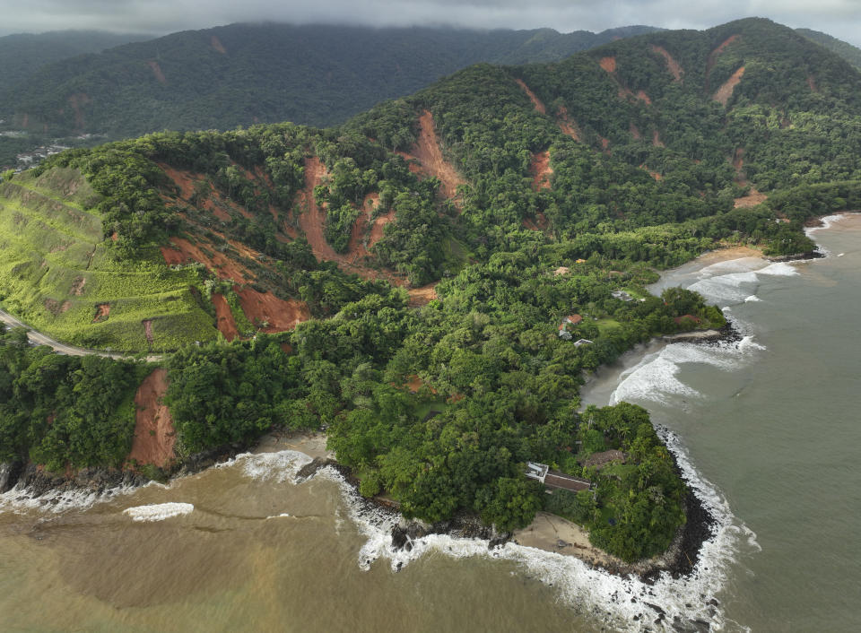 the Rio-Santos highway which connects the cities of Rio de Janeiro and Santos is blocked by mudslides triggered by heavy rains near the Barra do Sahi beach in the coastal city of Sao Sebastiao, Brazil, Monday, Feb. 20, 2023. (AP Photo/Andre Penner)