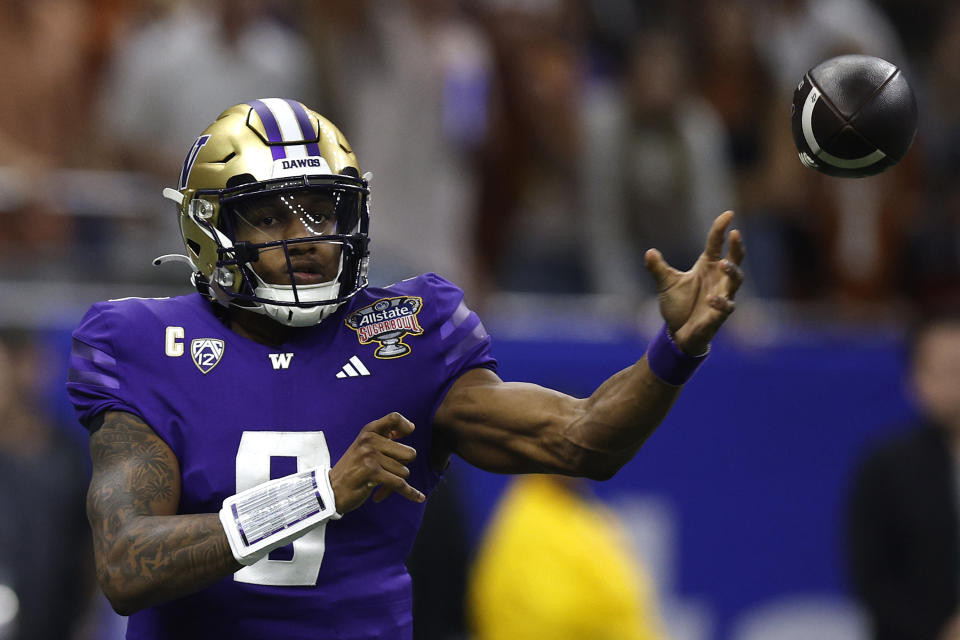 NEW ORLEANS, LA - JANUARY 1: No. 9 Michael Penix Jr. of the Washington Huskies during the CFP Semifinal Allstate Sugar Bowl at Caesars Superdome on January 1, 2024 in New Orleans, Louisiana. throws a pass during the first quarter against the Texas Longhorns.  (Photo by Sean Gardner/Getty Images)