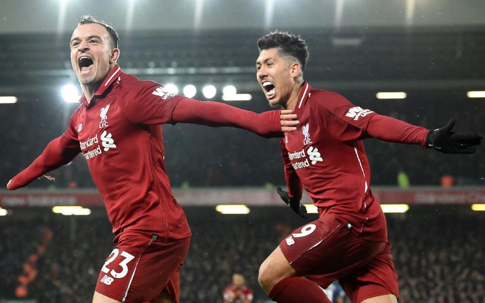 Roberto Firmino (right) could be celebrating against Wolves - AFP