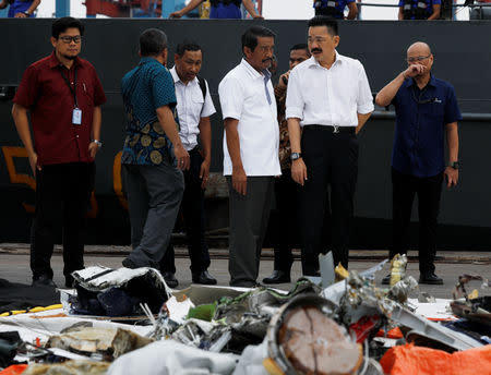 Lion Air CEO Edward Sirait (center L) and owner Rusdi Kirana (center R) inspect the recovered debris of Lion Air flight JT610 at Tanjung Priok port in Jakarta, Indonesia, October 30, 2018. REUTERS/Edgar Su