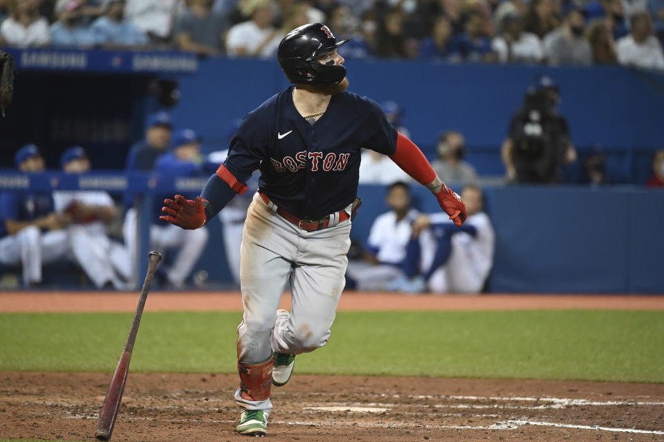 Boston Red Sox's Alex Verdugo hits a solo home run in the sixth inning of the second game of a baseball doubleheader against the Toronto Blue Jays in Toronto, Saturday Aug. 7, 2021. (Jon Blacker/The Canadian Press via AP)