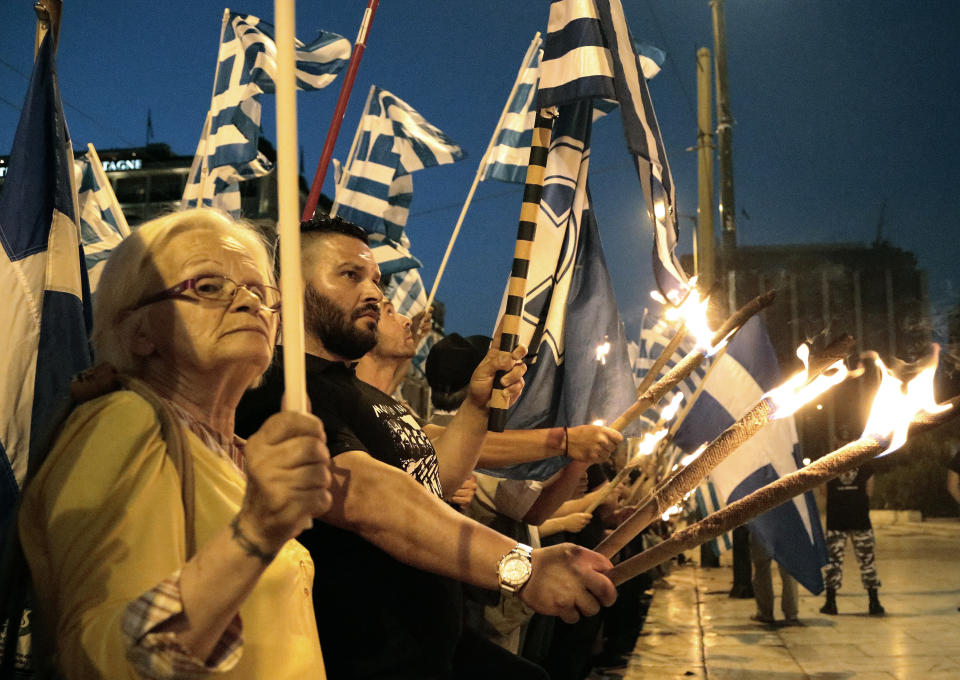 Members and supporters of the extreme right party Golden Dawn march in central Athens on Wednesday May 29, 2013, during a rally marking the anniversary of the fall of Constantinople to the Ottoman Empire in 1453. (AP Photo/Dimitri Messinis)