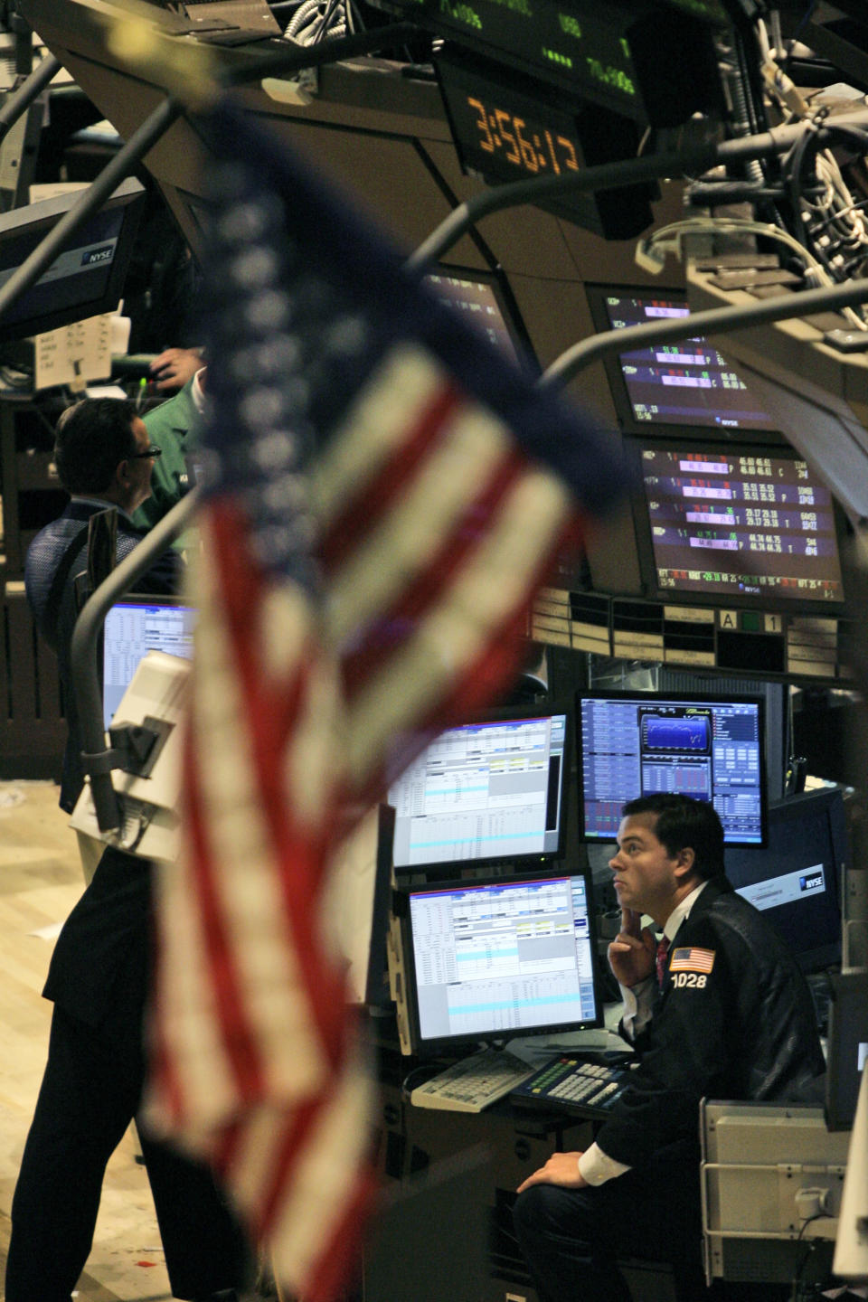 A trader keeps an eye on the numbers during the last half hour of trade on the floor of the New York Stock Exchange, Monday, July 16, 2007. (AP Photo/Mary Altaffer)