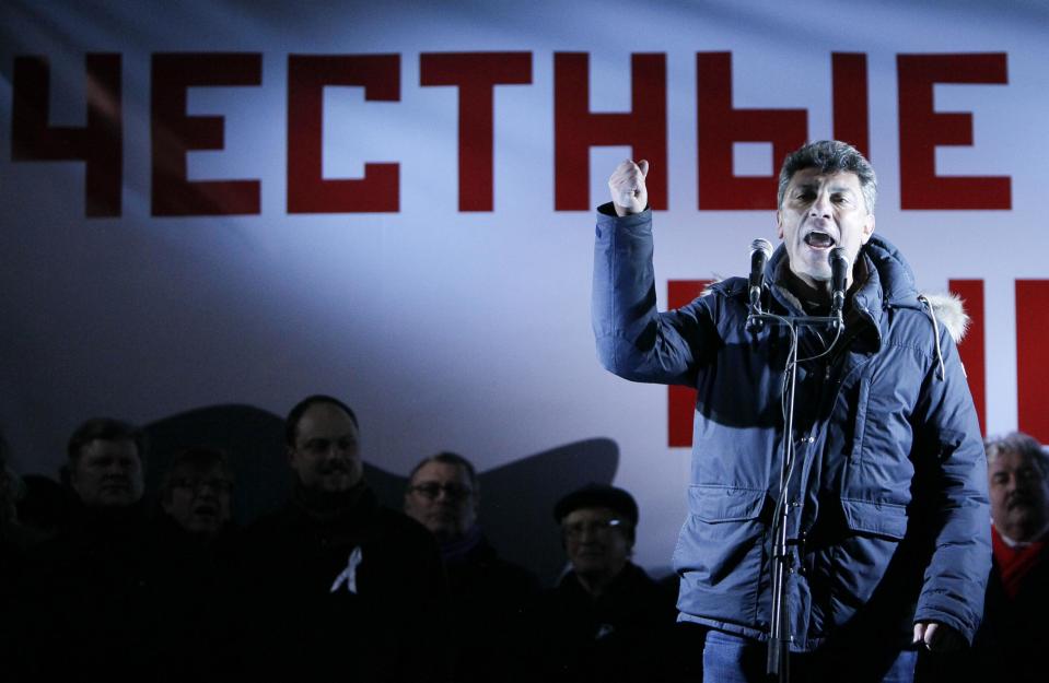 Opposition leader Boris Nemtsov addresses the crowd during a protest demanding fair elections in central Moscow in this March 5, 2012 file photo. The Russian opposition politician and former deputy prime minister Boris Nemtsov has been shot and killed by four shots in central Moscow, the Russian government said in a statement, according to the Interfax news agency. The word in the background reads "Honest..." Picture taken March 5, 2012. (REUTERS/Anton Golubev)