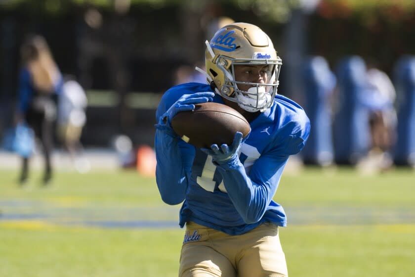 UCLA wide receiver Titus Mokiao-Atimalala catches the ball during Spring Showcase in Los Angeles, CA