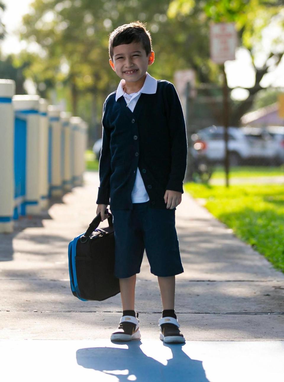 First-grader Noah Bonilla, 7, arrives for the first day of school at Winston Park Elementary School in Coconut Creek, Fla., on Tuesday, Aug. 16, 2022.