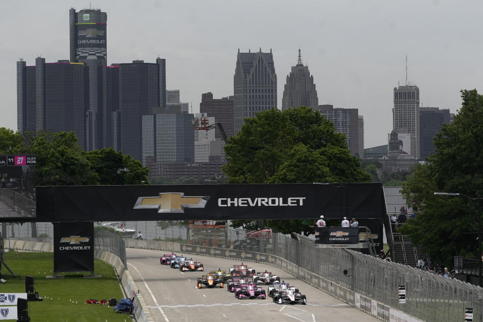 Josef Newgarden (2) leads the field into the start of the IndyCar Detroit Grand Prix auto race on Belle Isle in Detroit, Sunday, June 5, 2022. (AP Photo/Paul Sancya)