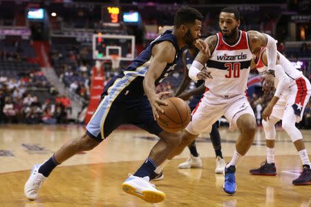 Dec 13, 2017; Washington, DC, USA; Memphis Grizzlies guard Andrew Harrison (5) drives to the basket as Washington Wizards forward Mike Scott (30) defends in the first quarter at Capital One Arena. Geoff Burke-USA TODAY Sports