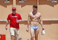 Apr 23, 2014; Mesa, AZ, USA; Michael Phelps arrives with his coach Bob Bowman for his first official practice session for the Arena Grand Prix swim meet at Skyline Aquatic Center. Rob Schumacher-USA TODAY Sports