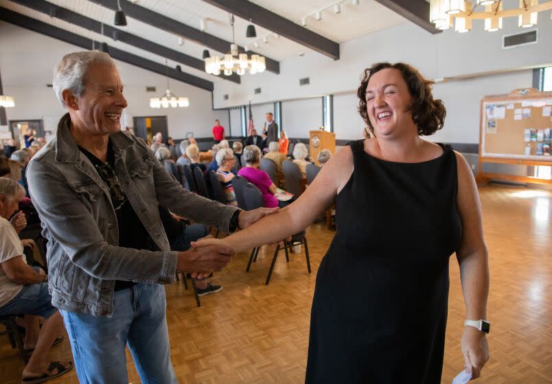 HUNTINGTON BEACH, CA - OCTOBER 17: Richard Bruck of Corona del Mar greets Rep. Katie Porter following her campaign stop at the Huntington Landmark Senior Community in Huntington Beach, CA on Monday, Oct. 17, 2022. Bruck said the two most pressing issues for him were the threat by Republicans to cut Social Security and Medicare. Porter is running for reelection for Congressional District 47 in Orange County. (Myung J. Chun / Los Angeles Times)