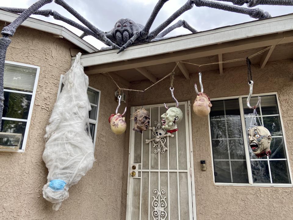 The huge spider and some severed heads on the Pachellas’ front door at home in 2020 (Collect/PA Real Life)