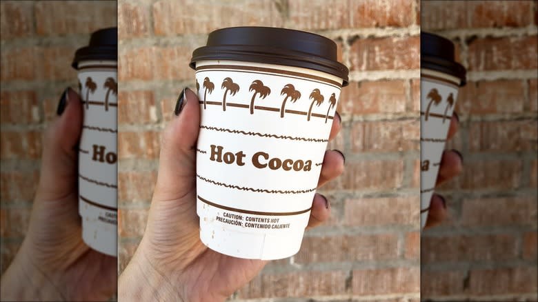 Hand holding hot cocoa
