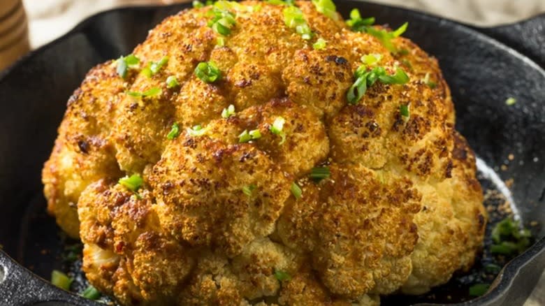 baked whole cauliflower in skillet