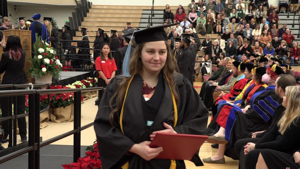 Grace Szymchack and her daughter, 10-day-old Annabelle, in a screengrab from Ferris State University's fall commencement on Dec. 15, 2023.