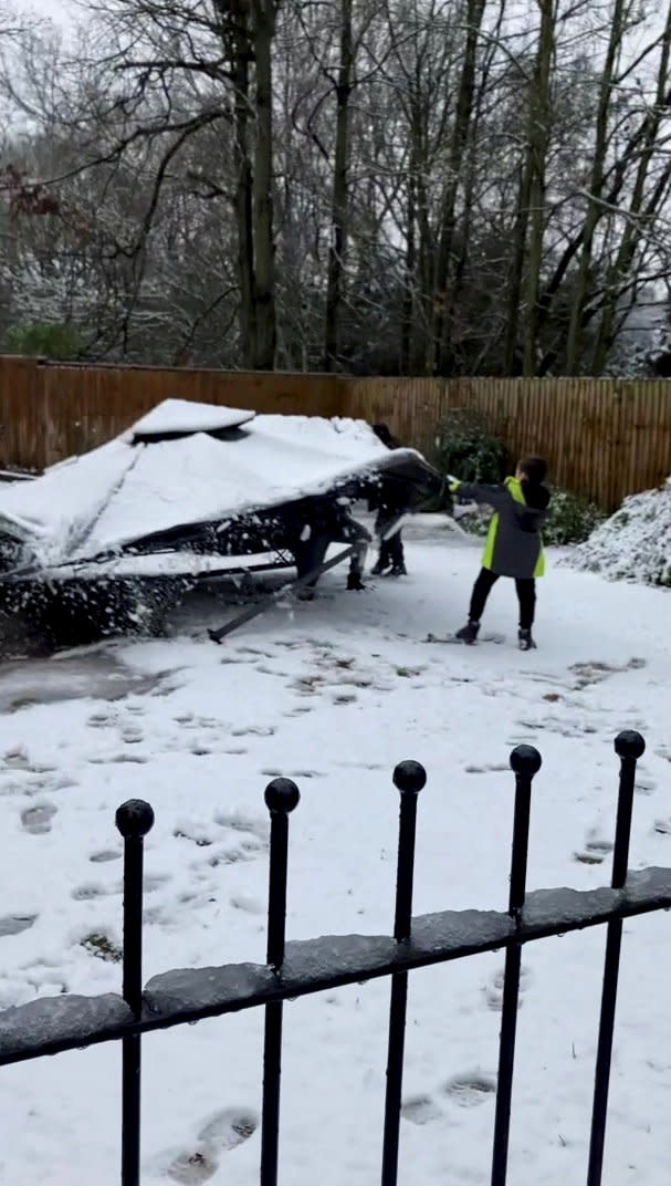 This is the moment a dad tried to cover his kids in snow from the top of his gazebo - only for it to completely collapse on top of him. Daniel Campbell, 34, tried to scrape off a bit of snow that had settled on the roof of the structure onto his kids Kacey, 15, Finley, 10, and Nate, seven, while wife Lucy, 34, filmed. But after failing to give them the shower he desired, his plan backfired and the gazebo collapsed on his head, leaving the whole family in hysterics.