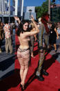 <p>We don’t think anyone has ever forgotten about when Rose Mcgowan turned up to the 1998 MTV VMAS in this very little number. <i>[Photo: REX] </i></p>