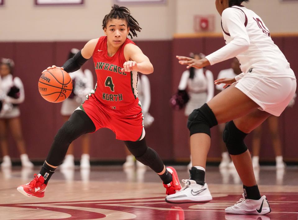 Lawrence North Wildcats guard Kya Hurt (4) rushes up the court Thursday, Dec. 7, 2023, during the game at Lawrence Central High School in Indianapolis. The Lawrence Central Bears defeated the Lawrence North Wildcats, 57-55.