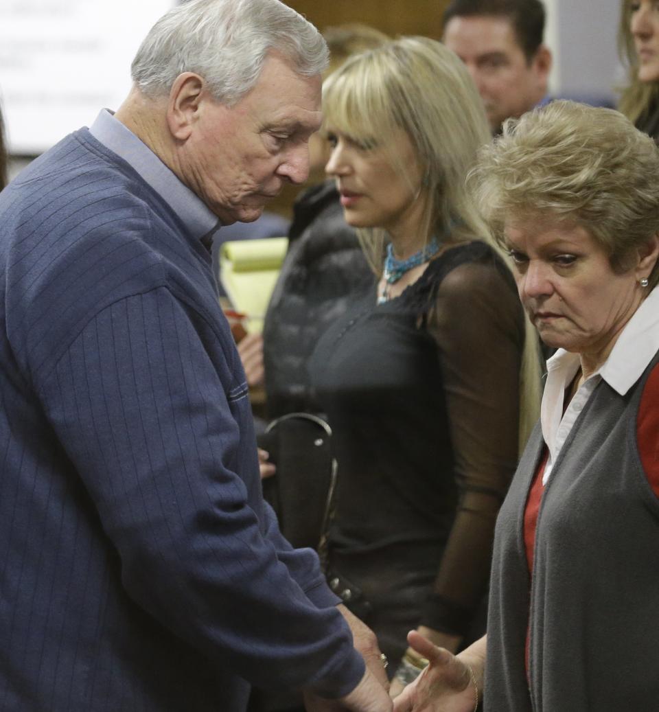 Don and Judy Littlefield, parents of Chad Littelfield, begin to walk out of the courtroom after a break in the capital murder trial of Eddie Ray Routh at the Erath County, Donald R. Jones Justice Center Friday, Feb. 20, 2015, in Stephenville, Texas.  Routh, 27, of Lancaster, is charged with the 2013 deaths of Littlefield and Navy SEAL Chris Kyle at a shooting range near Glen Rose, Texas. (AP Photo/LM Otero,Pool)