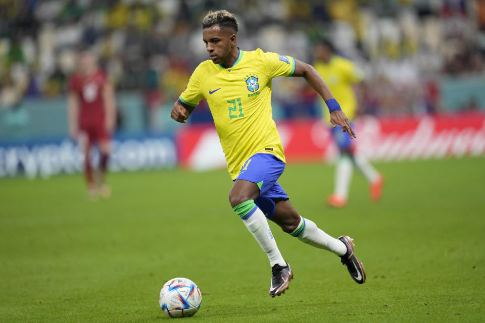 Brazil's Rodrygo runs with the ball during the World Cup group G soccer match between Brazil and Serbia, at the Lusail Stadium in Lusail, Qatar, Thursday, Nov. 24, 2022. (AP Photo/Andre Penner)