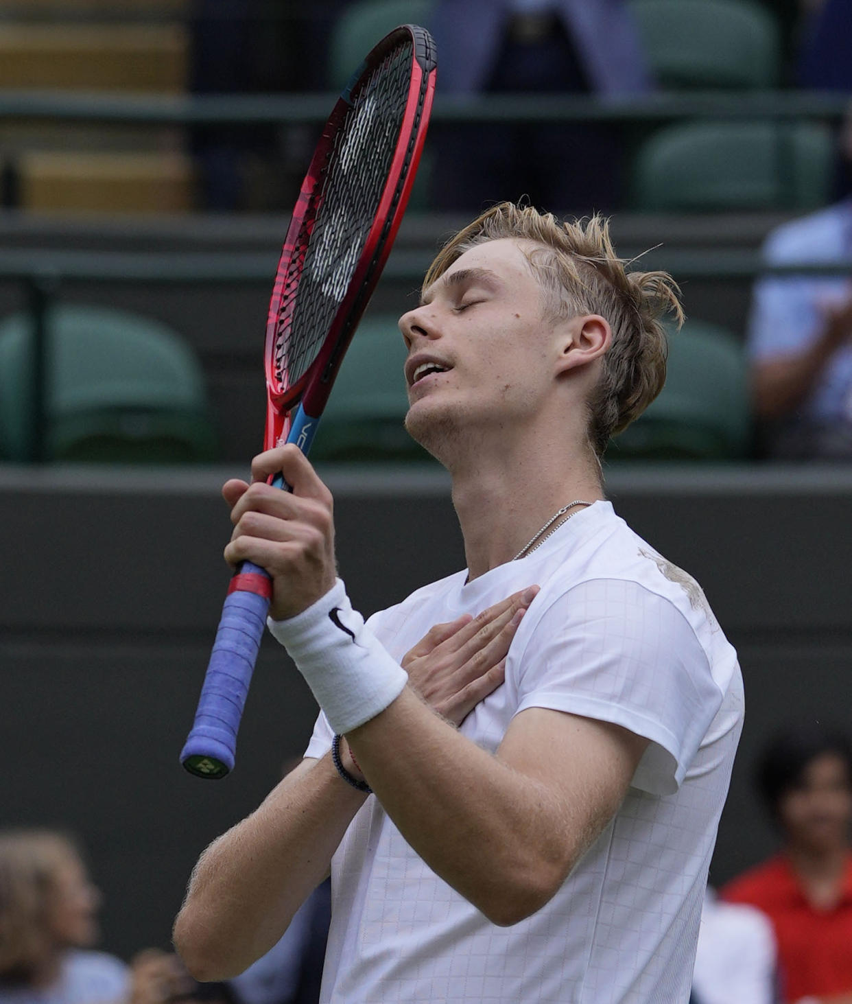 Canada's Denis Shapovalov celebrates after defeating Russia's Karen Khachanov during the men's singles quarterfinals match on day nine of the Wimbledon Tennis Championships in London, Wednesday, July 7, 2021. (AP Photo/Alastair Grant)