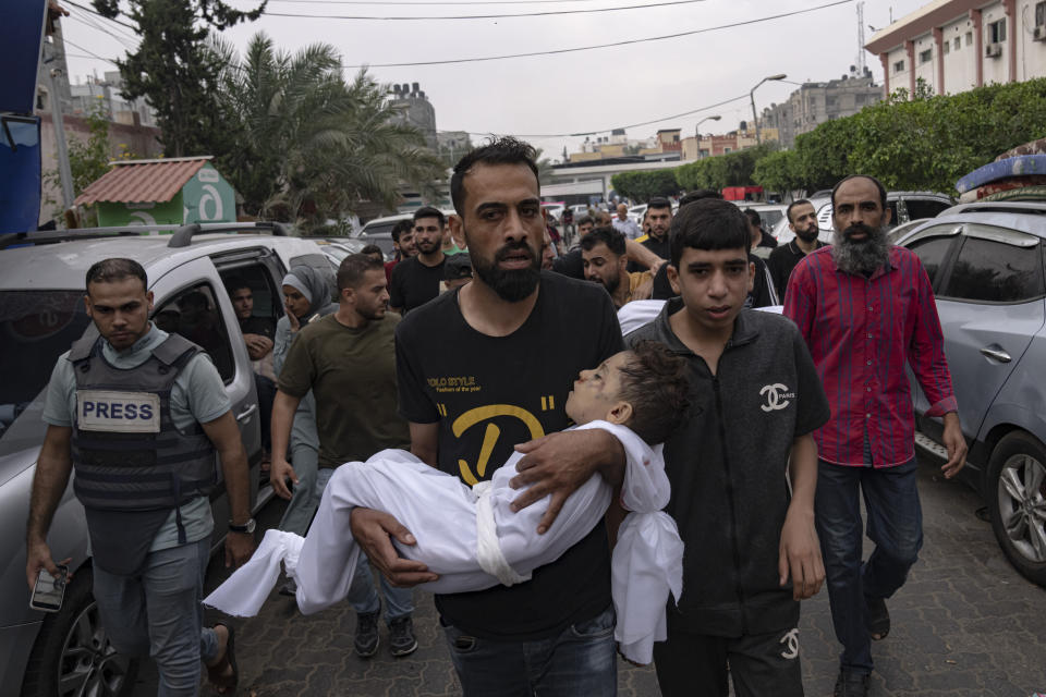 Palestinian mourners carry the body of their relatives killed in the Israeli bombardment of the Gaza Strip, in Khan Younis, Sunday, Oct. 29, 2023. ( AP Photo/Fatima Shbair)