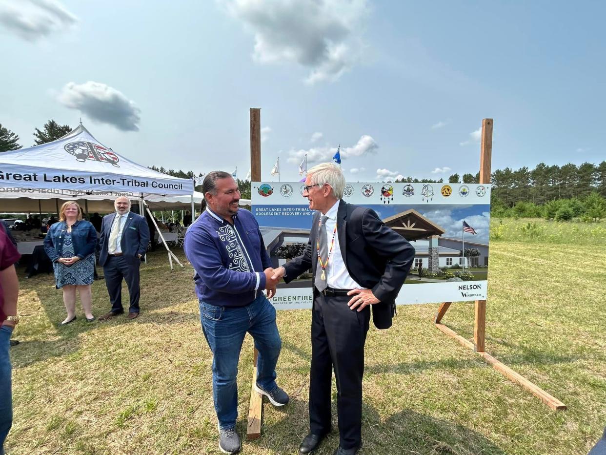 Oneida Nation Chairman Tehassi Hill (right) shakes hands with Wisconsin Gov. Tony Evers during a ground blessing ceremony for a planned Native youth drug treatment center in Tomahawk.