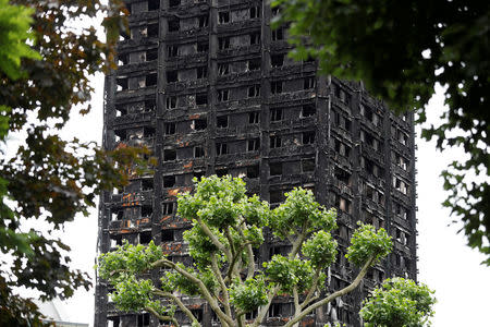 FILE PHOTO: Damage to Grenfell Tower is seen following the catastrophic fire, in north Kensington, London, Britain, June 25, 2017. REUTERS/Peter Nicholls/File Photo