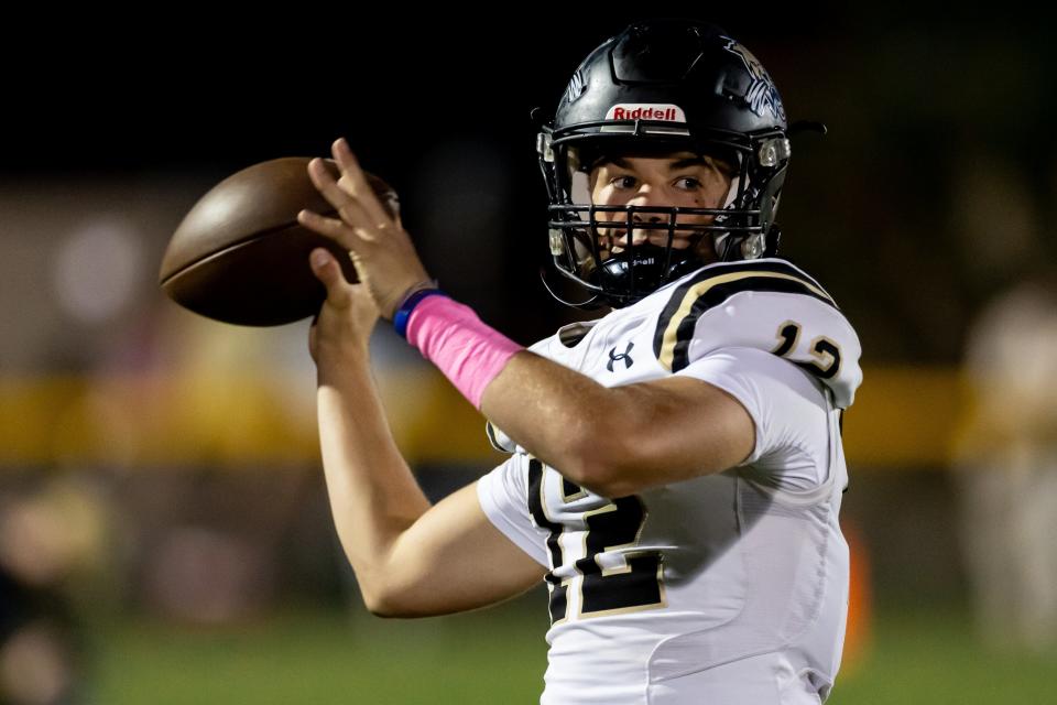 Buchholz Bobcats quarterback Trace Johnson (12) warms up on the sideline before the game against the Gainesville Hurricanes at Citizens Field in Gainesville, FL on Thursday, October 5, 2023. [Matt Pendleton/Gainesville Sun]