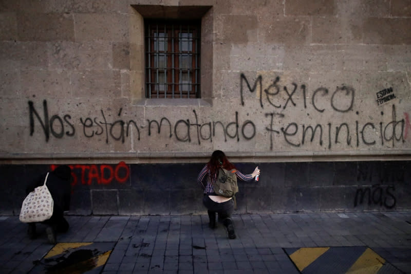 People take part in a protest against gender-based violence in downtown of Mexico City