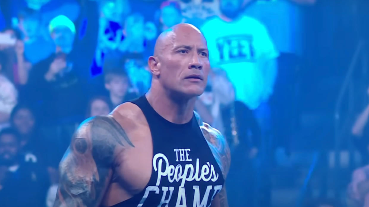  The Rock standing in the ring during his return on WWE Smackdown. 