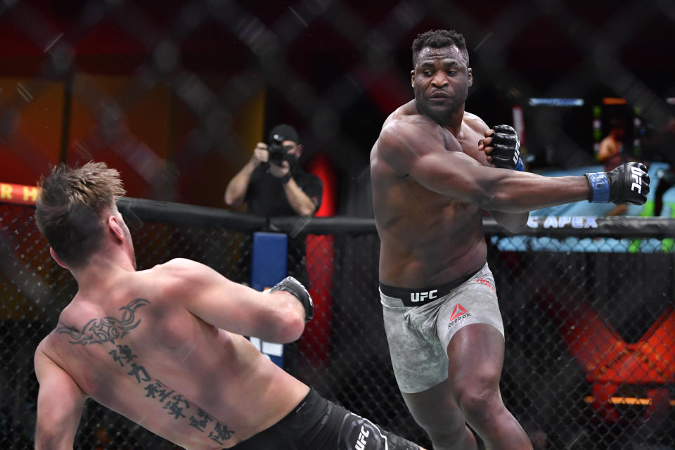 LAS VEGAS, NEVADA - MARCH 27: (R-L) Francis Ngannou of Cameroon drops Stipe Miocic in their UFC heavyweight championship fight during the UFC 260 event at UFC APEX on March 27, 2021 in Las Vegas, Nevada. (Photo by Chris Unger/Zuffa LLC)