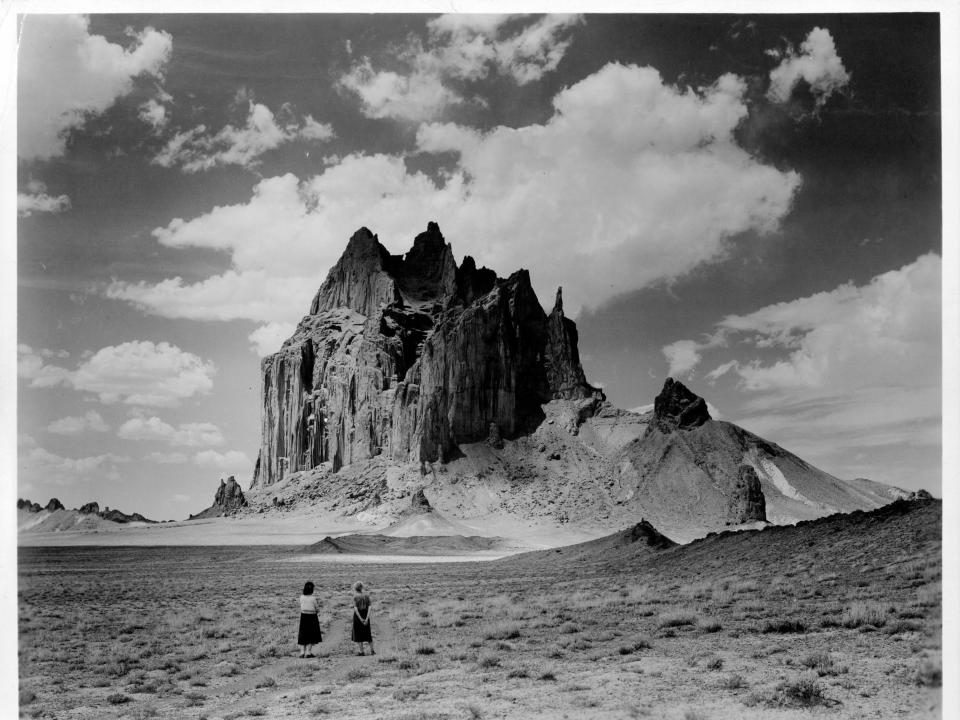 Two women stand in plains in Navajo Nation in New Mexico, circa 1940.