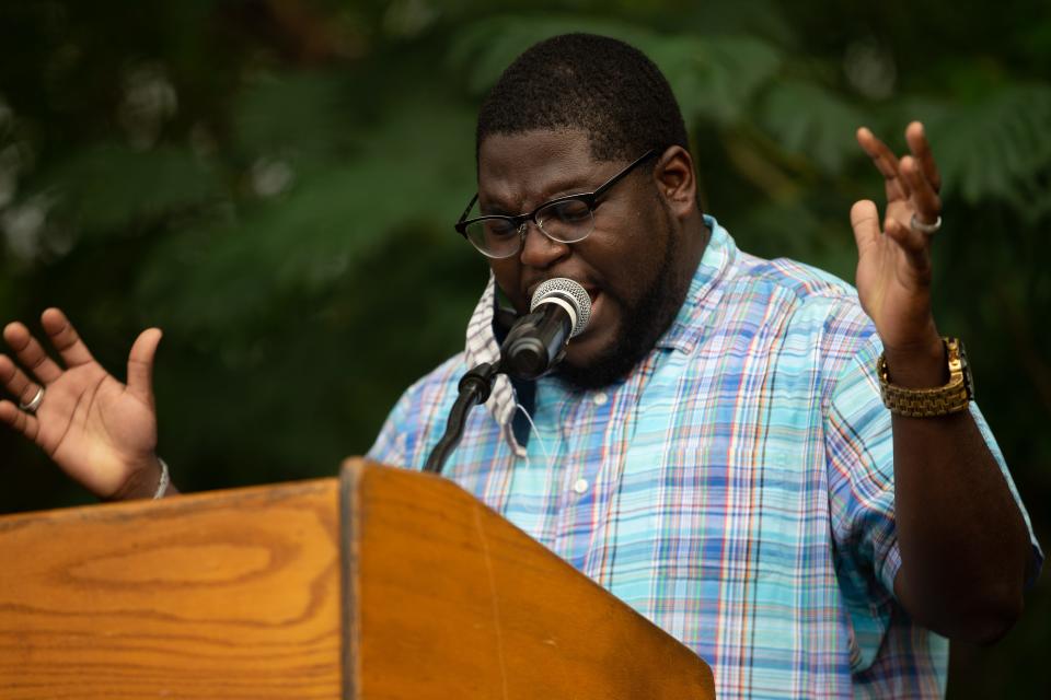 Nims Middle School Principal Benny Bolden, who helped spearhead the pilot program for overage fifth graders, leads a prayer during a community gathering at Walker Ford Community Center Friday, June 5, 2020.