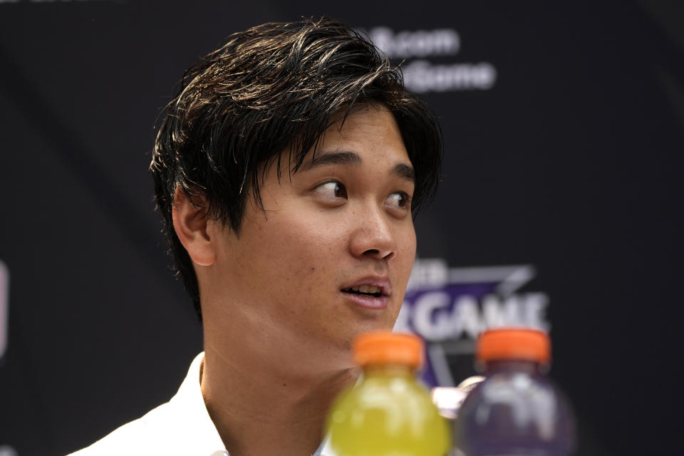 Shohei Ohtani, of the Los Angeles Angeles, speaks after being named the American League's starting pitcher for the MLB All-Star baseball game, Monday, July 12, 2021, in Denver. (AP Photo/David Zalubowski)