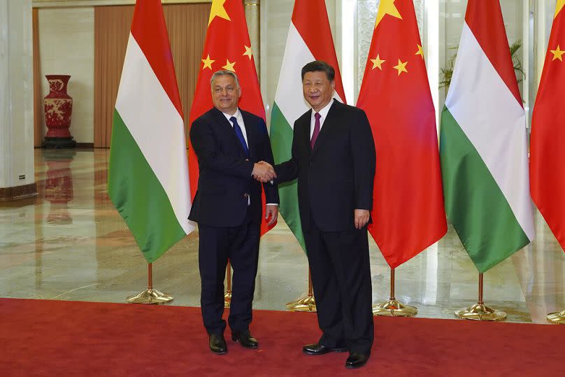 Chinese Prime Minister Xi Jinping, right, shakes hands with Hungarian Prime Minister Viktor Orban before the bilateral meeting of the Second Belt and Road Forum.
