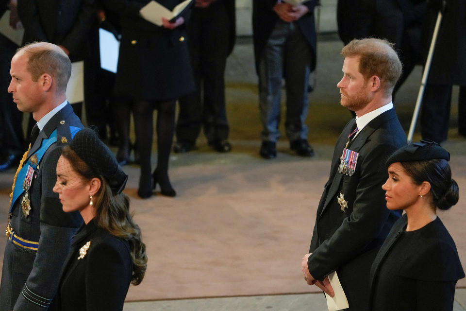 <p>Britain's Kate, Princess of Wales, from left, Prince William, Meghan, Duchess of Sussex and Prince Harry stand in Westminster Hall after participating in the procession of the coffin of Queen Elizabeth, London, Wednesday, Sept. 14, 2022. The Queen will lie in state in Westminster Hall for four full days before her funeral on Monday Sept. 19. Gregorio Borgia/Pool via REUTERS</p> 