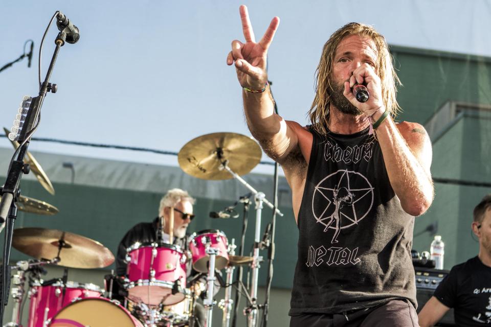 Hawkins and Chevy Metal performing with Queen’s Roger Taylor in 2018. - Credit: Andy Keilen