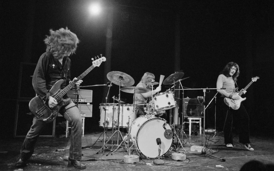 Gallagher performing with bassist Gerry McAvoy and drummer Wilgar Campbell at London's Roundhouse  - Hulton Archive 