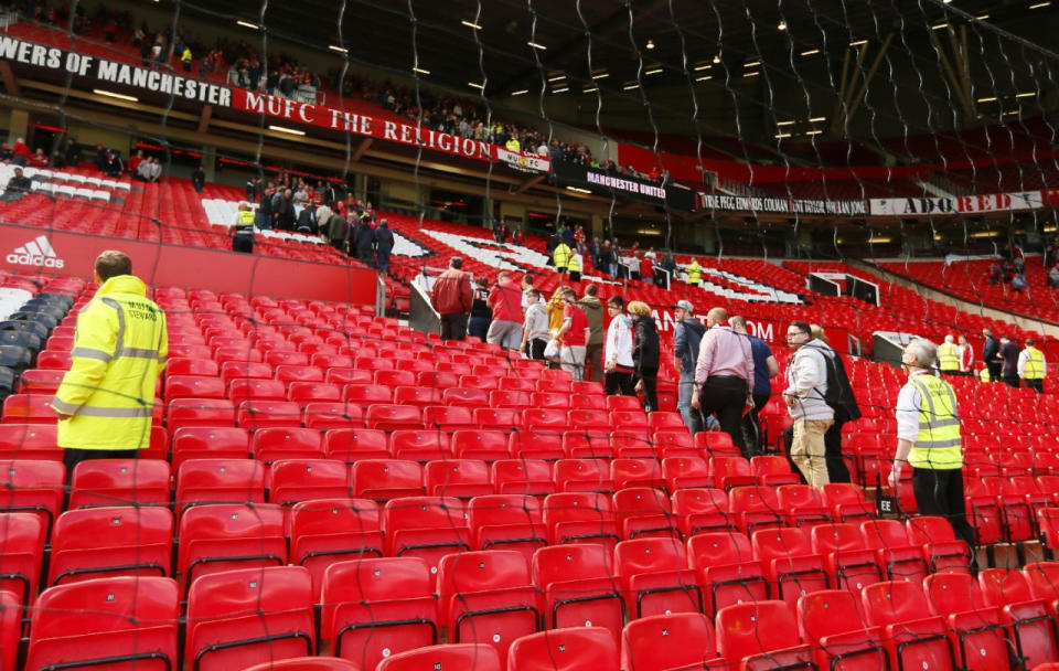Fans are evacuated from Old Trafford stadium before the Barclays Premier League match between Manchester United and AFC Bournemouth in Manchester, England, on May 15, 2016. (Jason Cairnduff/Livepic/Action Images via Reuters)