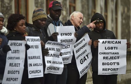 People participate in a vigil against Anglican Homophobia, outside the General Synod of the Church of England in London, Britain, February 15, 2017. REUTERS/Hannah McKay